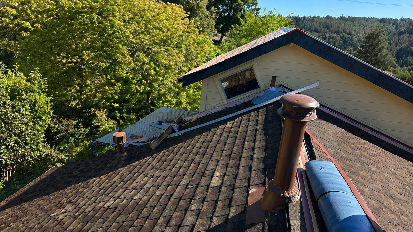 Roof preparation before metal roofing installation in Walsh Landing Sonoma County CA showing shingles and materials
